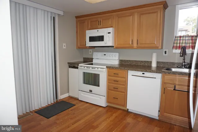 a kitchen with a stove and a microwave