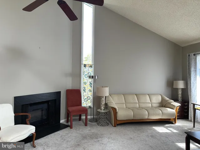 a bedroom with a bed and a chair