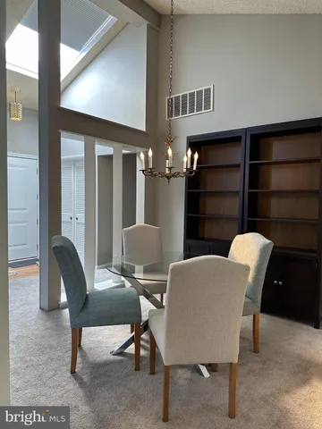 a view of a livingroom with furniture and a lamp