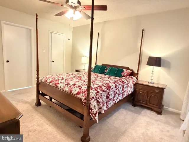 a bedroom with a bed window and wall painting