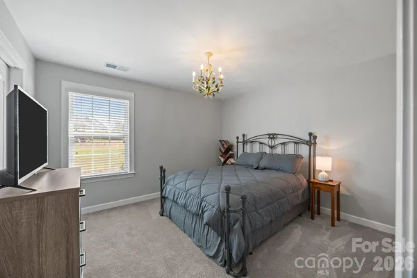 a bedroom with a workspace