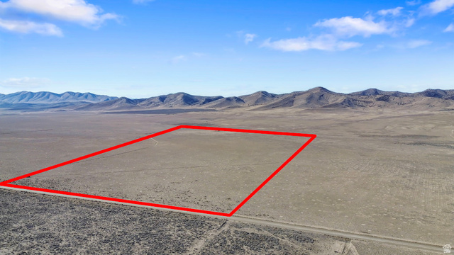 18150 South Allens Rnch Road West Cedar Valley, UT 84013 - Photo 11 of 15 Aerial view of property and surrounding area featuring property boundaries highlighted and a mountainous background