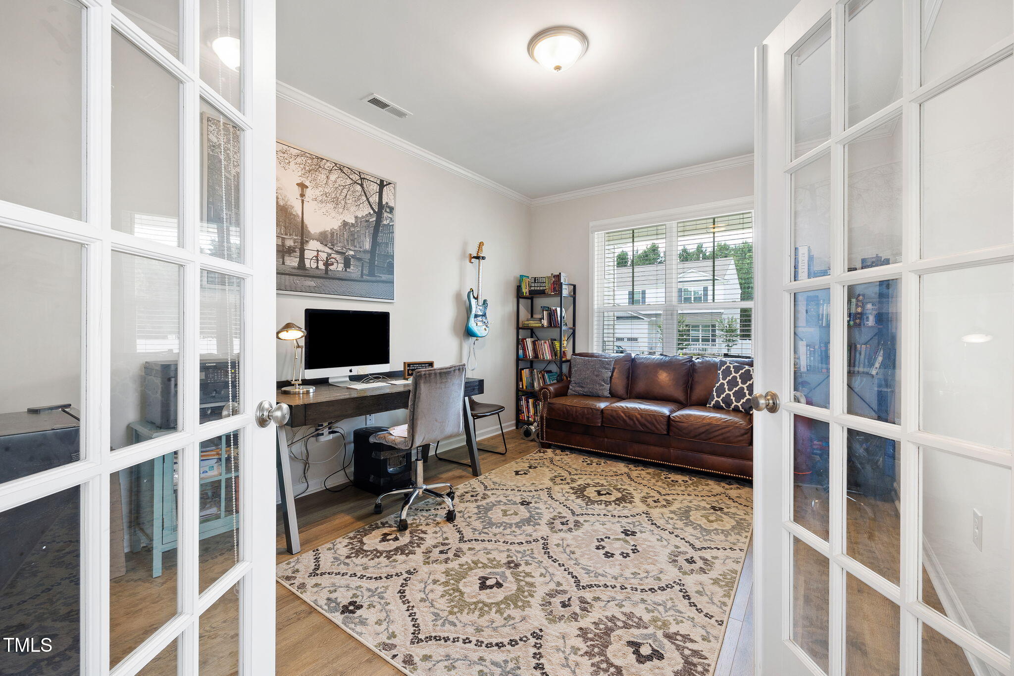 95 Madden Rose Loop Garner, NC 27529 - Photo 12 of 51 a living room with furniture a flat screen tv and a fireplace