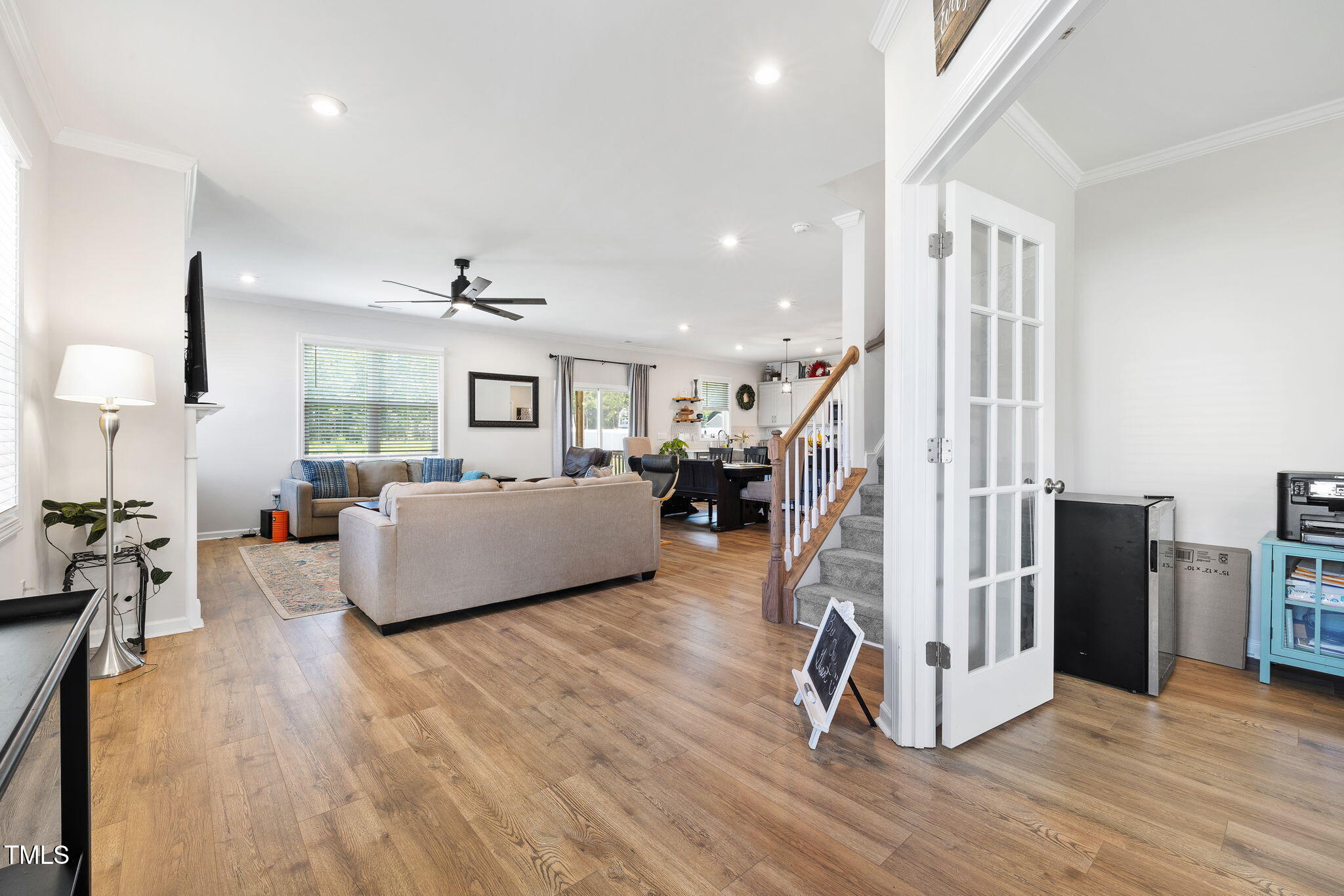 95 Madden Rose Loop Garner, NC 27529 - Photo 14 of 51 a living room with furniture floor to ceiling window and wooden floor