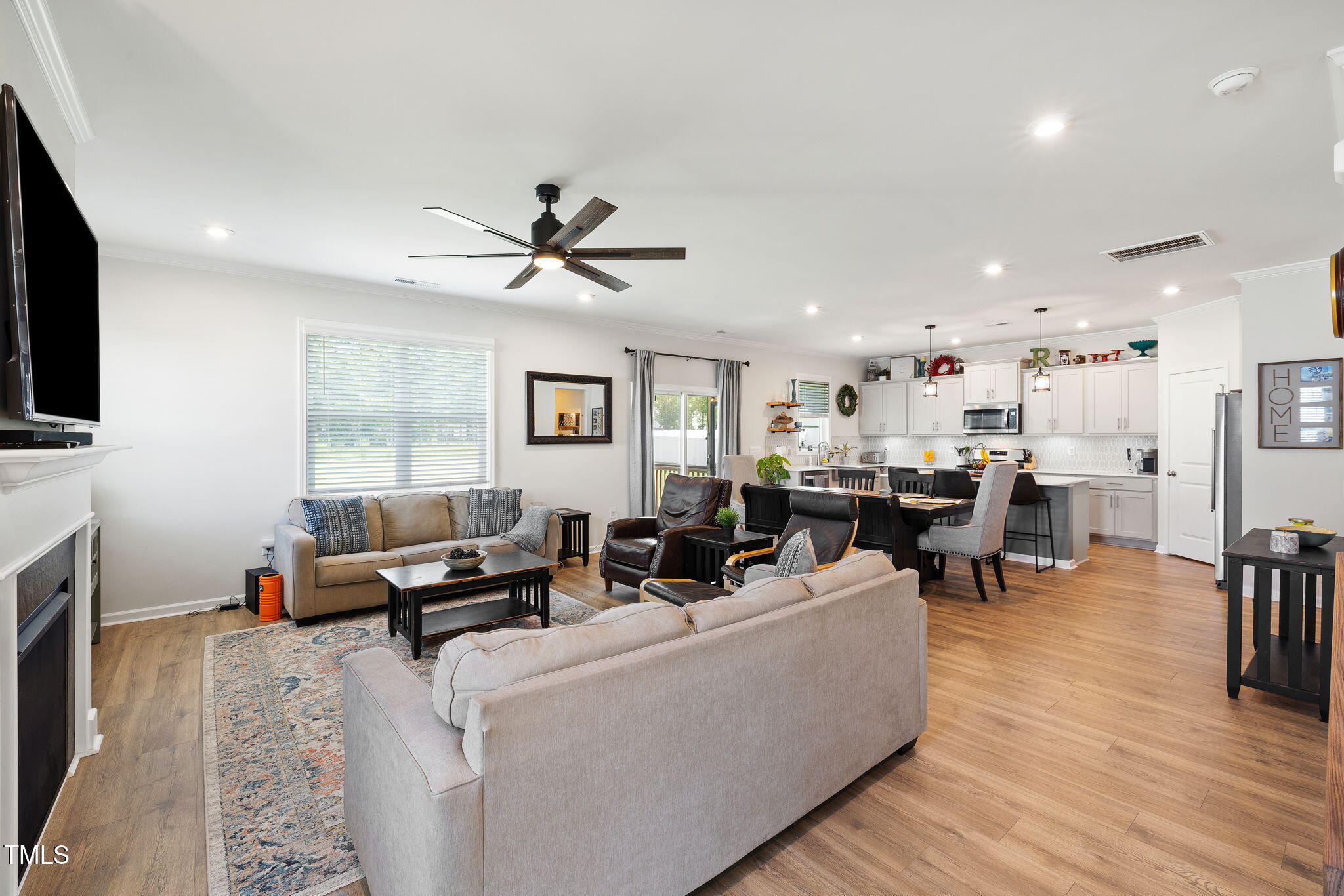 95 Madden Rose Loop Garner, NC 27529 - Photo 16 of 51 a living room with furniture and a flat screen tv
