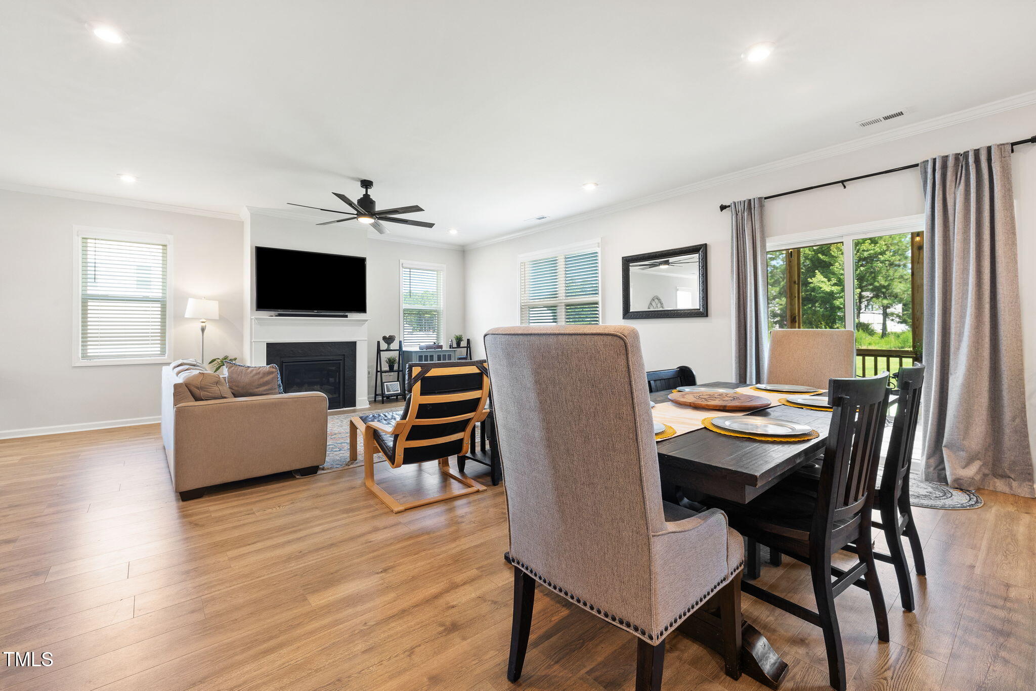 95 Madden Rose Loop Garner, NC 27529 - Photo 24 of 51 a view of a dining room with furniture window and wooden floor