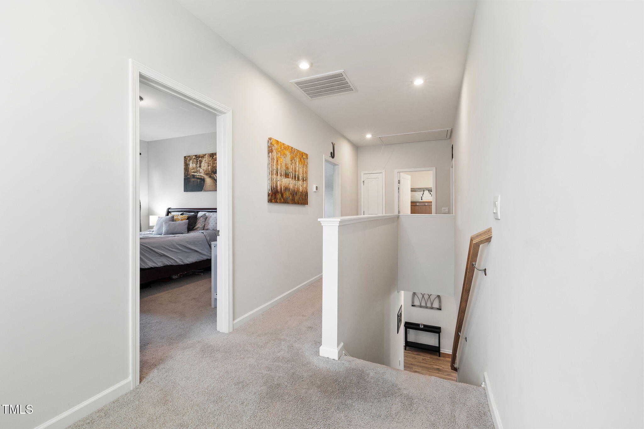 95 Madden Rose Loop Garner, NC 27529 - Photo 27 of 51 a view of a hallway with furniture and a livingroom