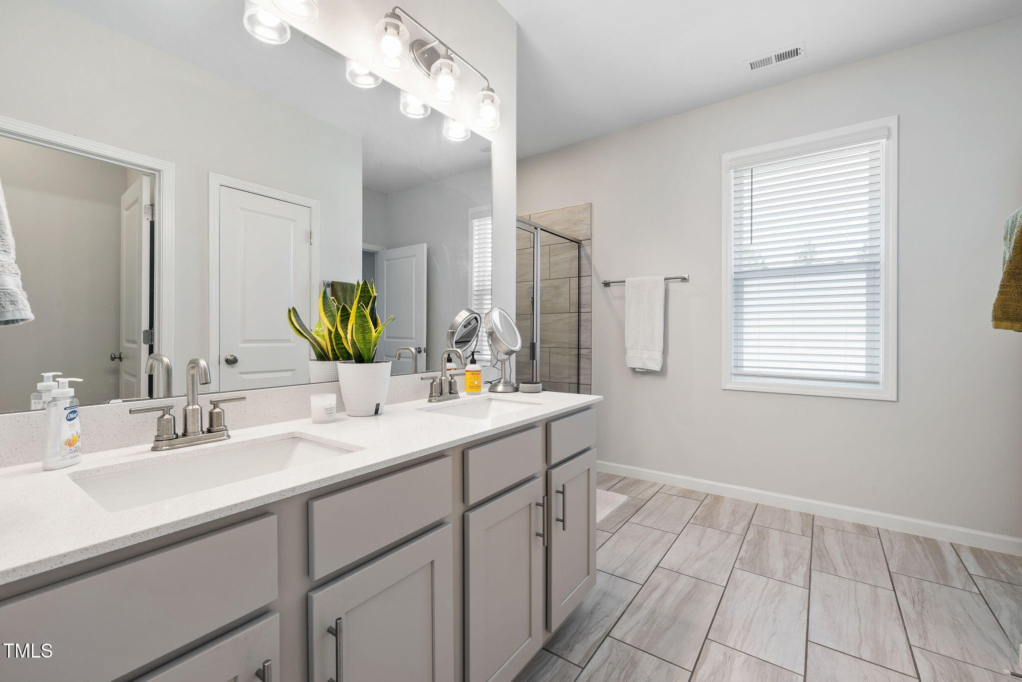 95 Madden Rose Loop Garner, NC 27529 - Photo 34 of 51 a bathroom with a sink and a mirror