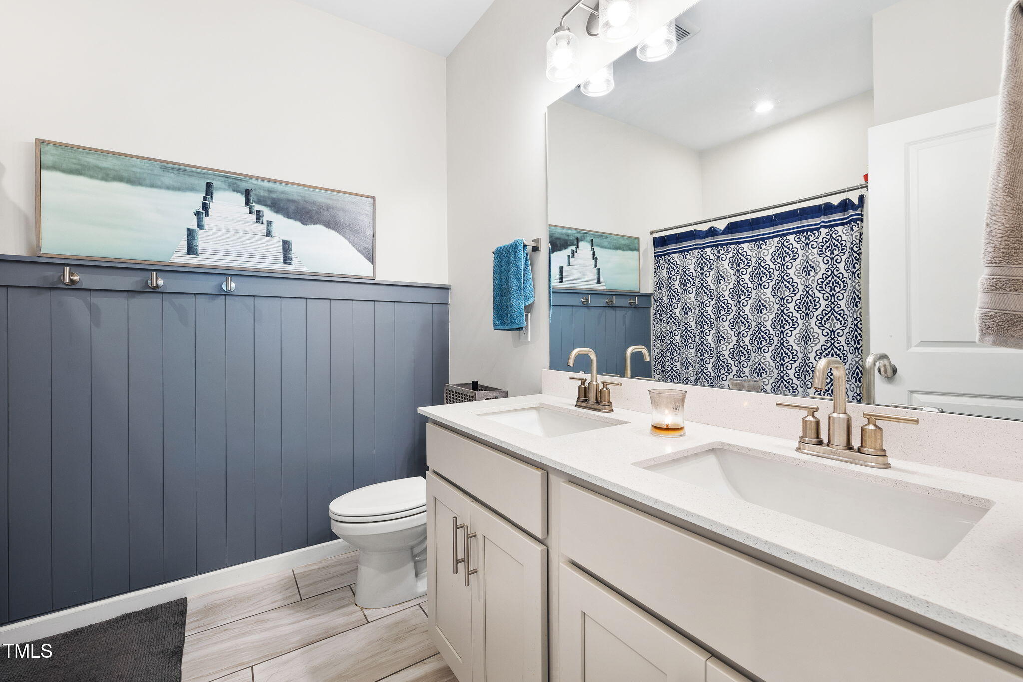 95 Madden Rose Loop Garner, NC 27529 - Photo 36 of 51 a bathroom with a sink a toilet and mirror