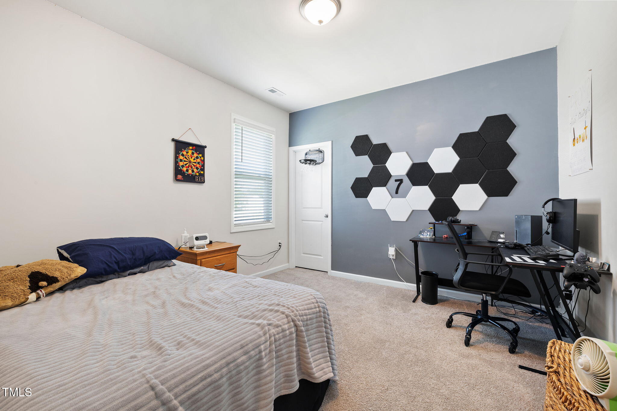 95 Madden Rose Loop Garner, NC 27529 - Photo 37 of 51 a bedroom with a large bed and a chandelier