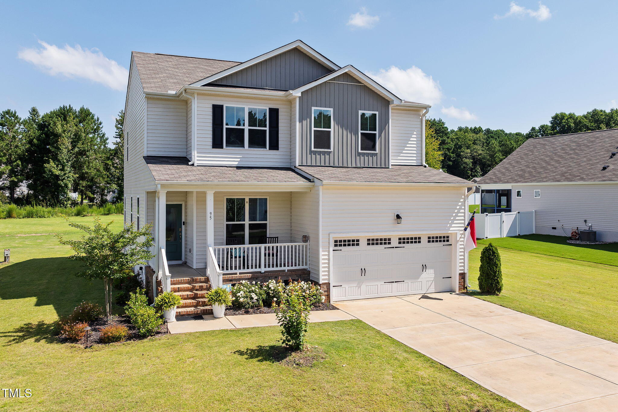 95 Madden Rose Loop Garner, NC 27529 - Photo 3 of 51 a front view of a house with a yard