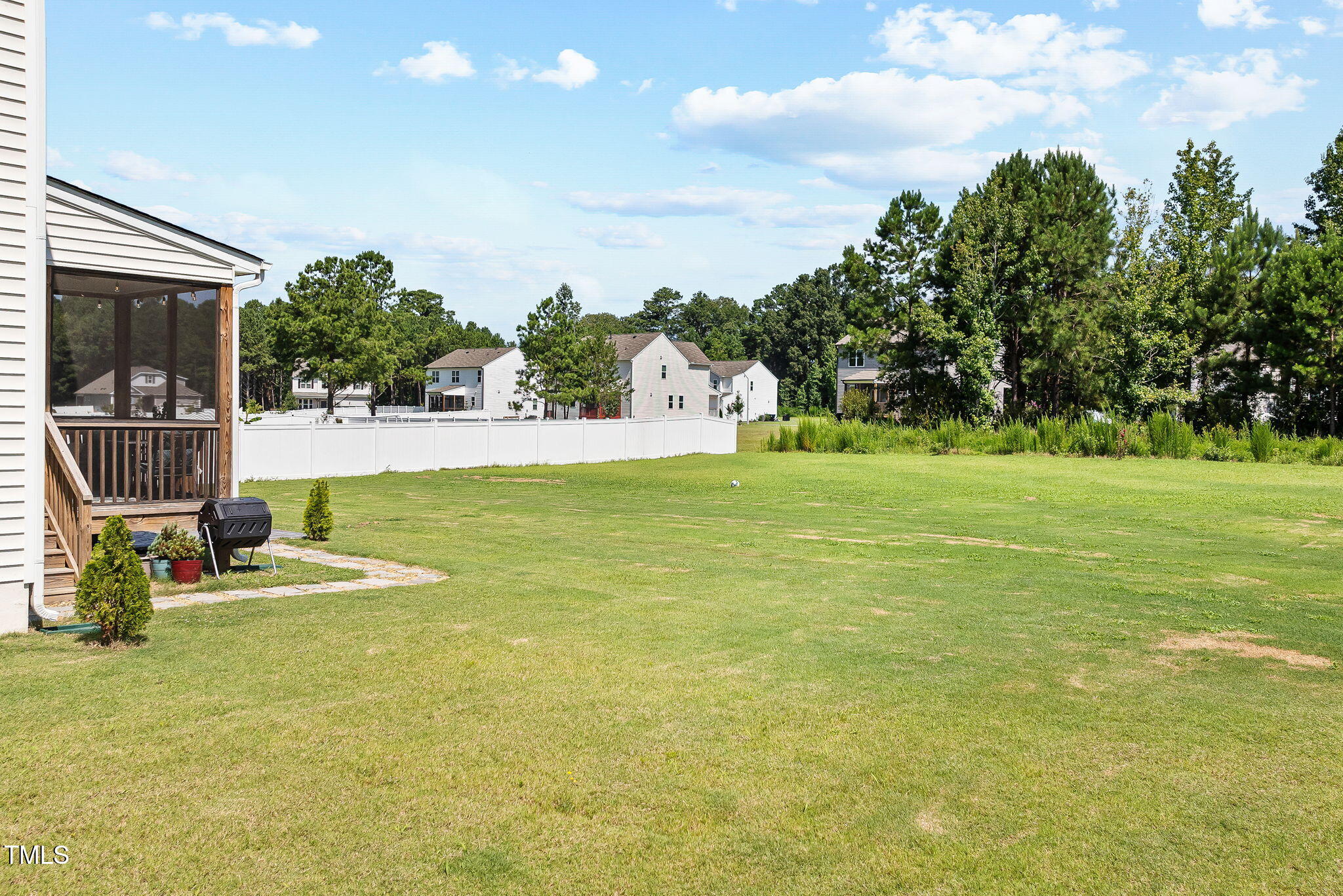 95 Madden Rose Loop Garner, NC 27529 - Photo 44 of 51 a view of a swimming pool with an outdoor space and seating area