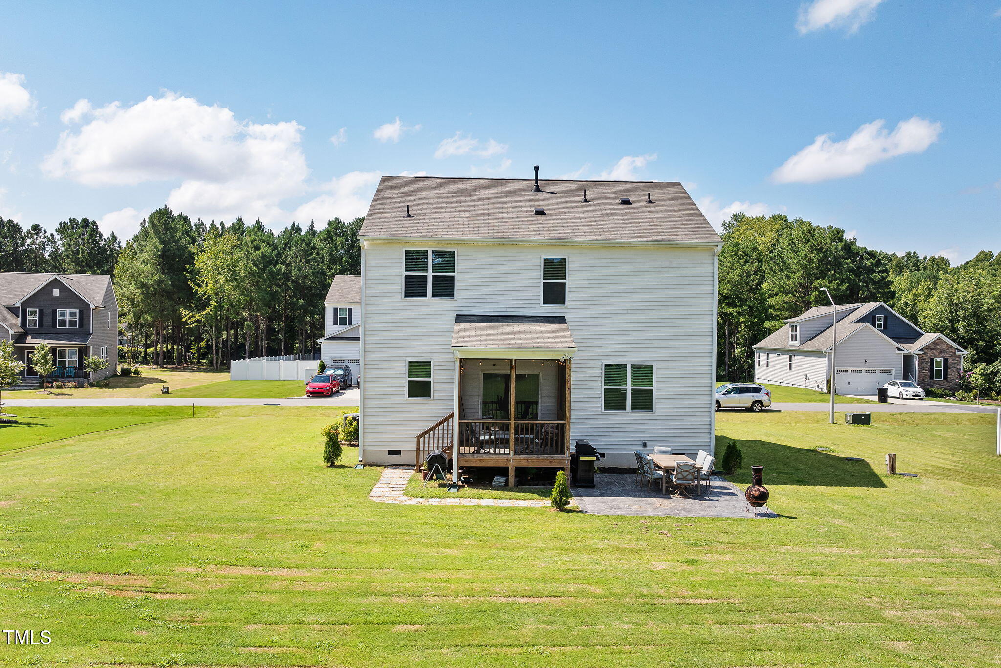 95 Madden Rose Loop Garner, NC 27529 - Photo 45 of 51 a view of a swimming pool with a table and chairs under an umbrella