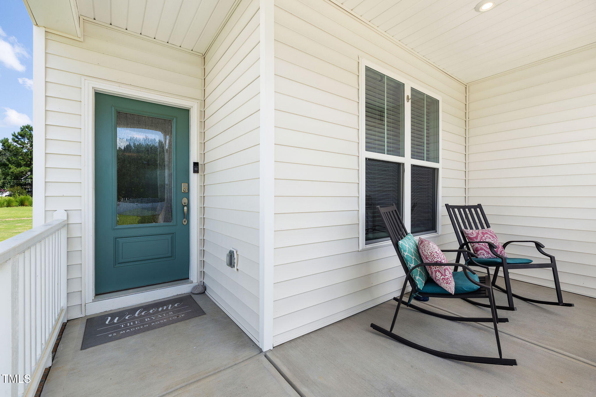 95 Madden Rose Loop Garner, NC 27529 - Photo 8 of 51 a view of a entryway with a wooden door and a chair