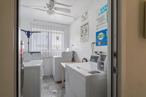 a view of bathroom with a sink and washing machine