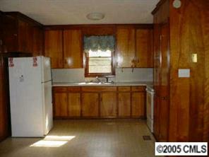 511 Shue Road China Grove, NC 28023 - Photo 3 of 8 a kitchen with a refrigerator and a stove