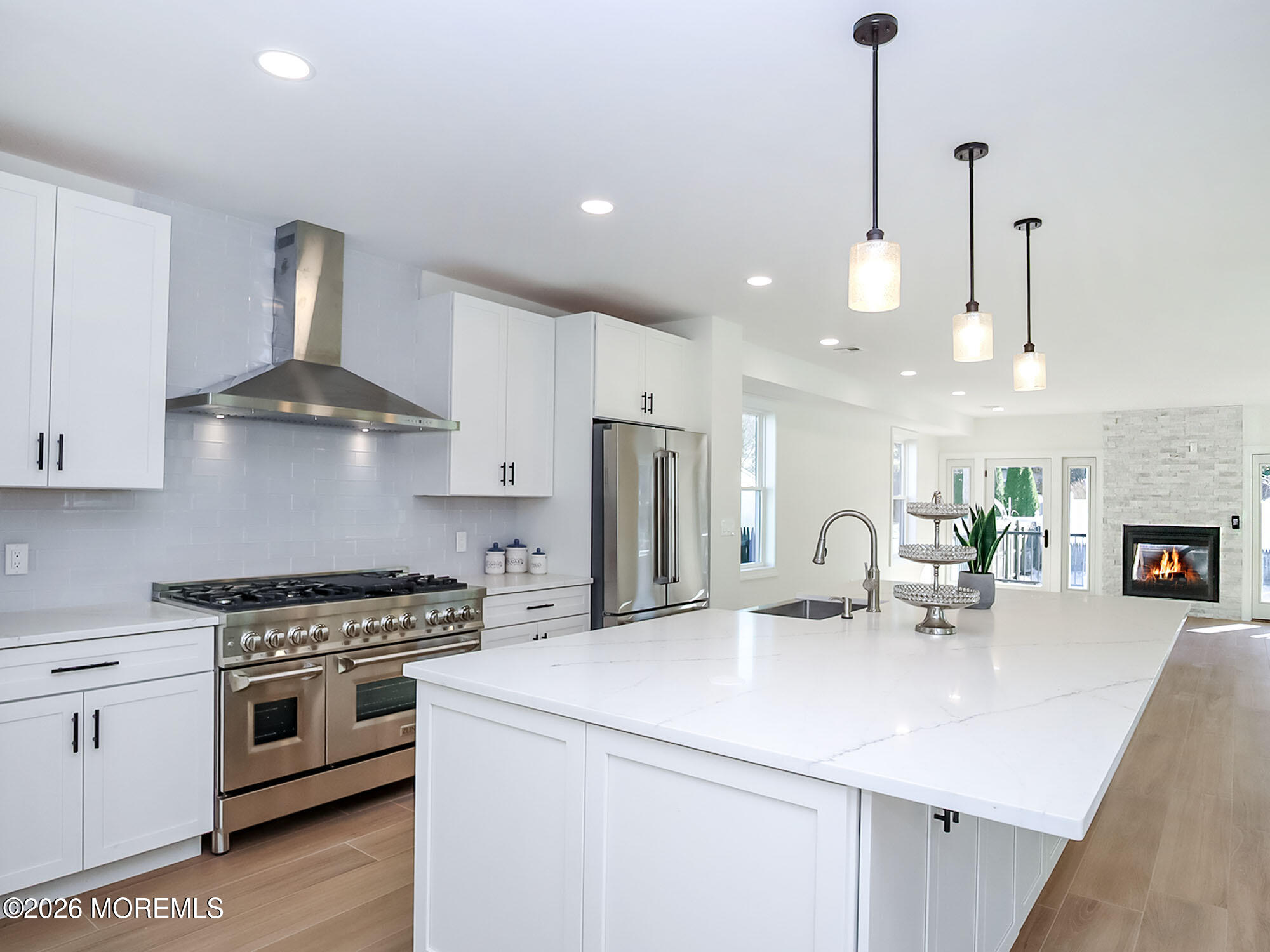 22 Marion Street Red Bank, NJ 07701 - Photo 1 of 50 a kitchen with stainless steel appliances a sink a stove a chimney a refrigerator and cabinets