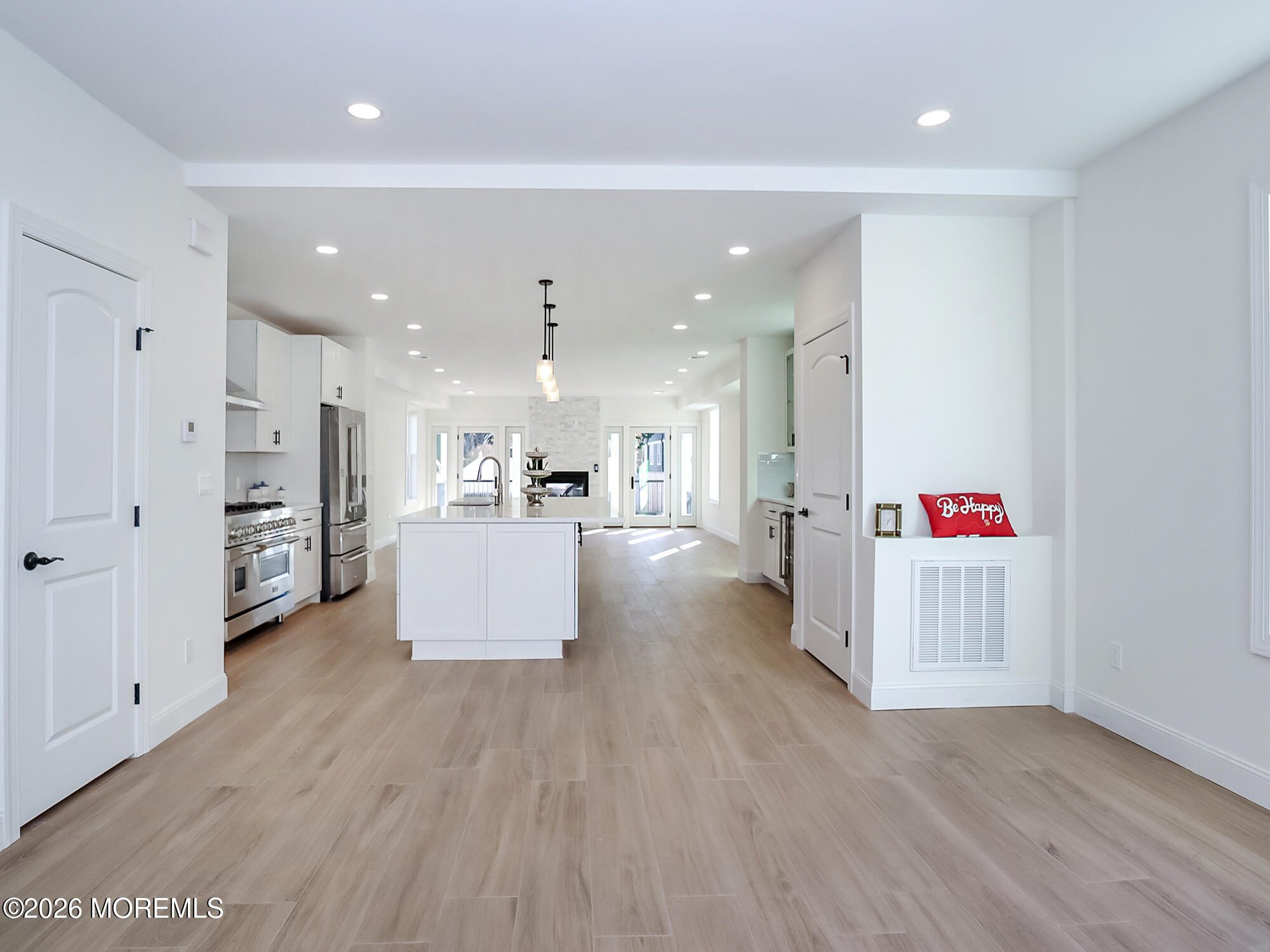 22 Marion Street Red Bank, NJ 07701 - Photo 11 of 50 an open kitchen with white cabinets and stainless steel appliances