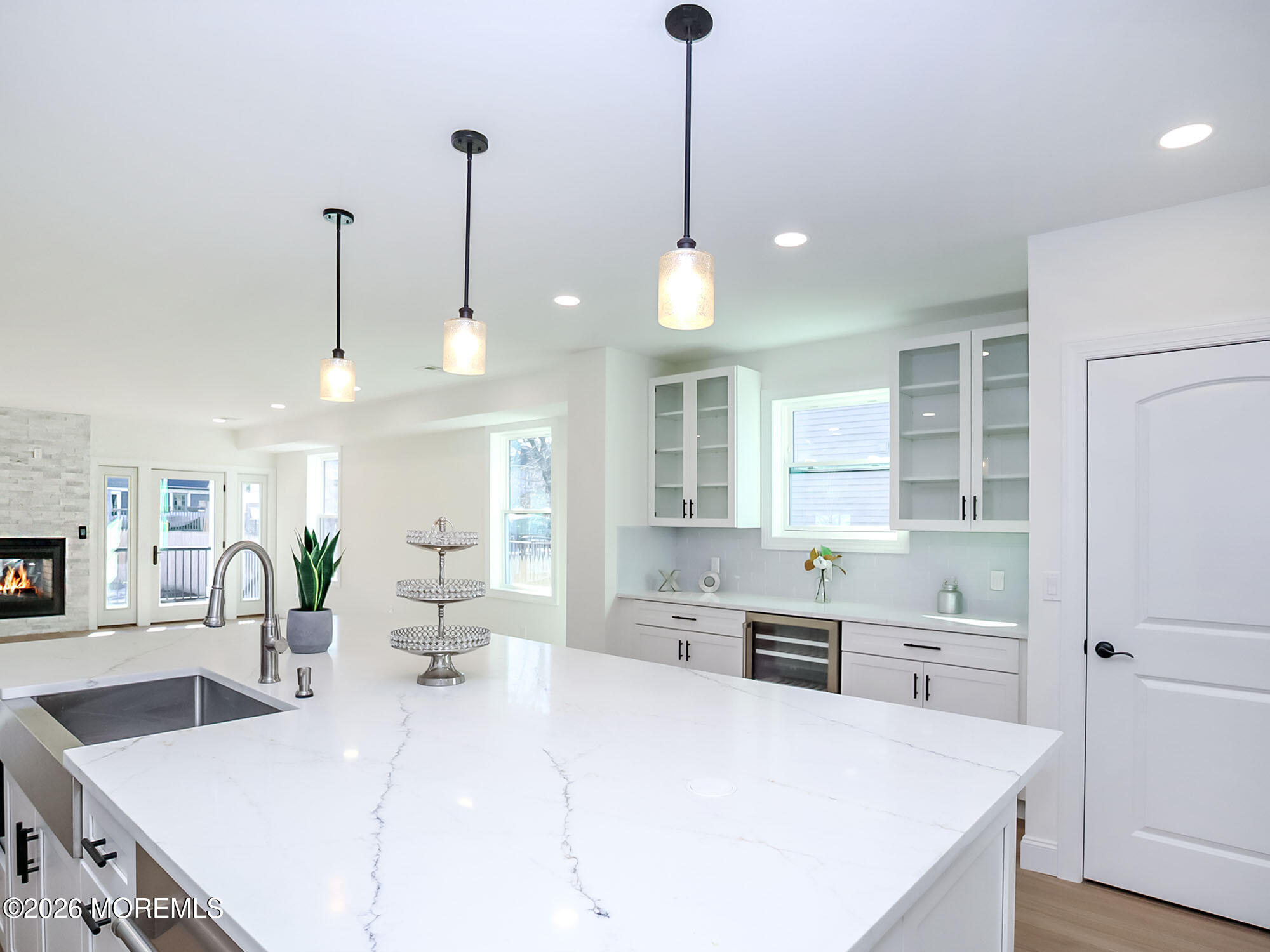 22 Marion Street Red Bank, NJ 07701 - Photo 15 of 50 a large kitchen with kitchen island a stove a sink a center island a counter space and wooden floor