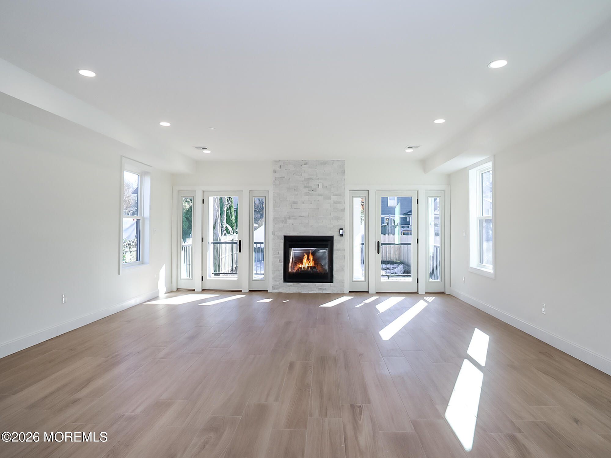 22 Marion Street Red Bank, NJ 07701 - Photo 18 of 50 a view of an empty room with wooden floor and a window