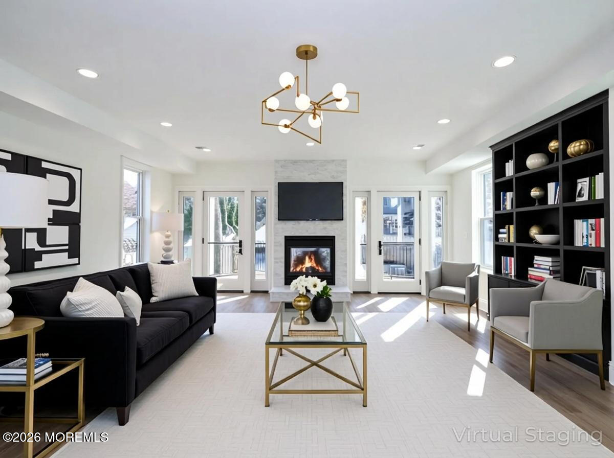22 Marion Street Red Bank, NJ 07701 - Photo 20 of 50 a living room with furniture a fireplace and a flat screen tv