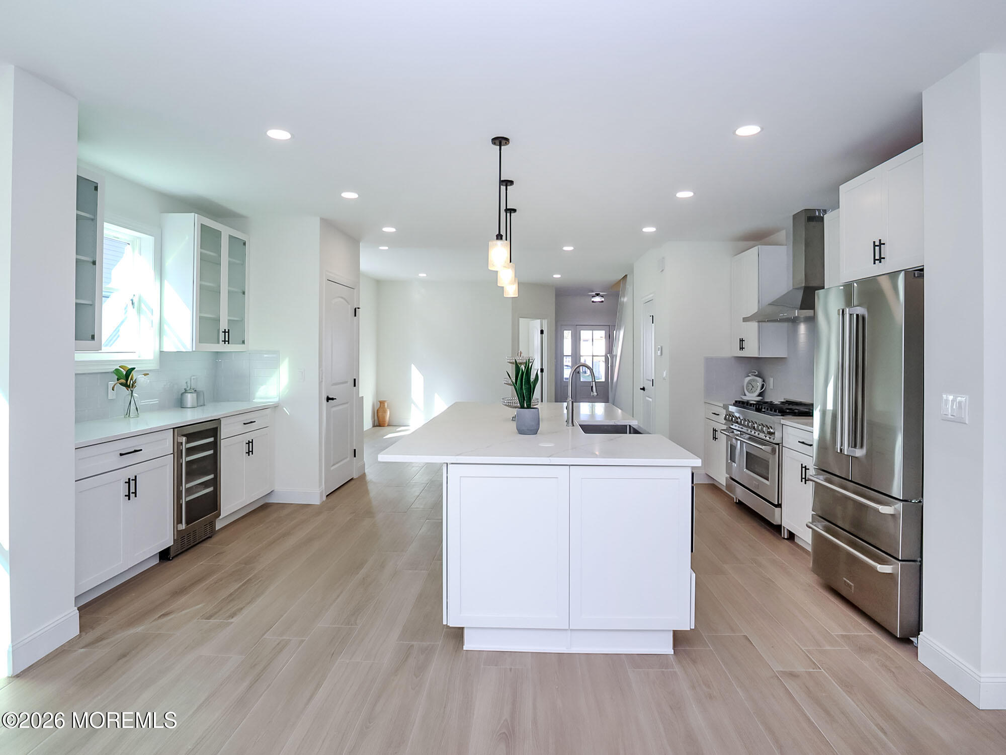 22 Marion Street Red Bank, NJ 07701 - Photo 22 of 50 a large kitchen with stainless steel appliances kitchen island a large counter top and a stove top oven