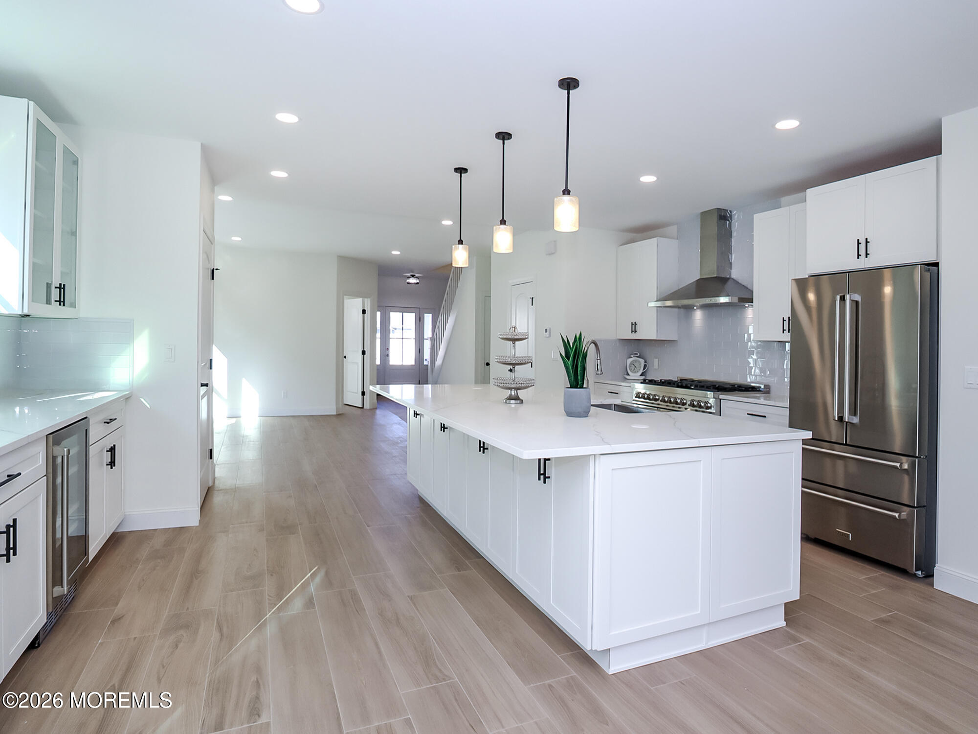22 Marion Street Red Bank, NJ 07701 - Photo 23 of 50 a large kitchen with stainless steel appliances kitchen island a large counter top and a wooden floors