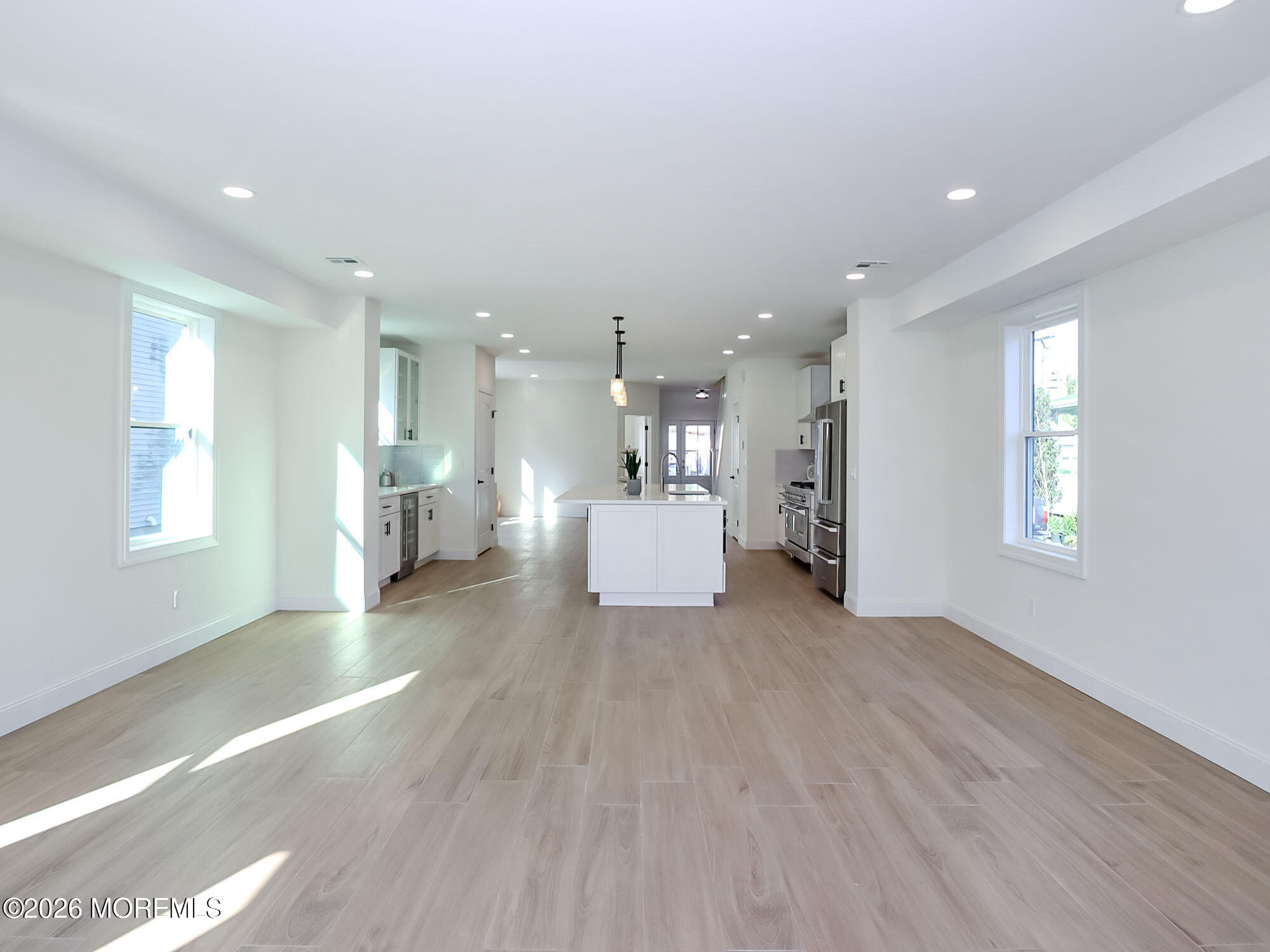 22 Marion Street Red Bank, NJ 07701 - Photo 27 of 50 a view of a big room with wooden floor and windows