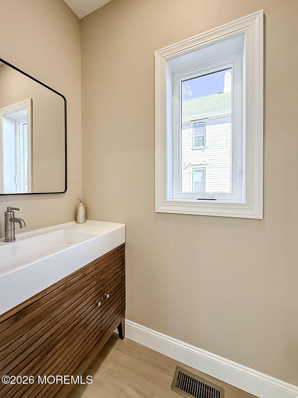 22 Marion Street Red Bank, NJ 07701 - Photo 28 of 50 a bathroom with a sink and a mirror
