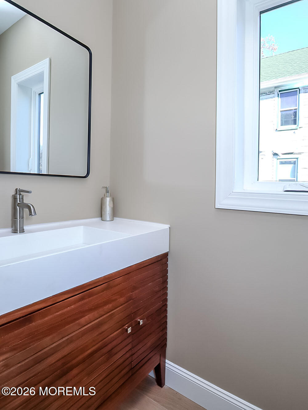 22 Marion Street Red Bank, NJ 07701 - Photo 29 of 50 a bathroom with a sink and a mirror