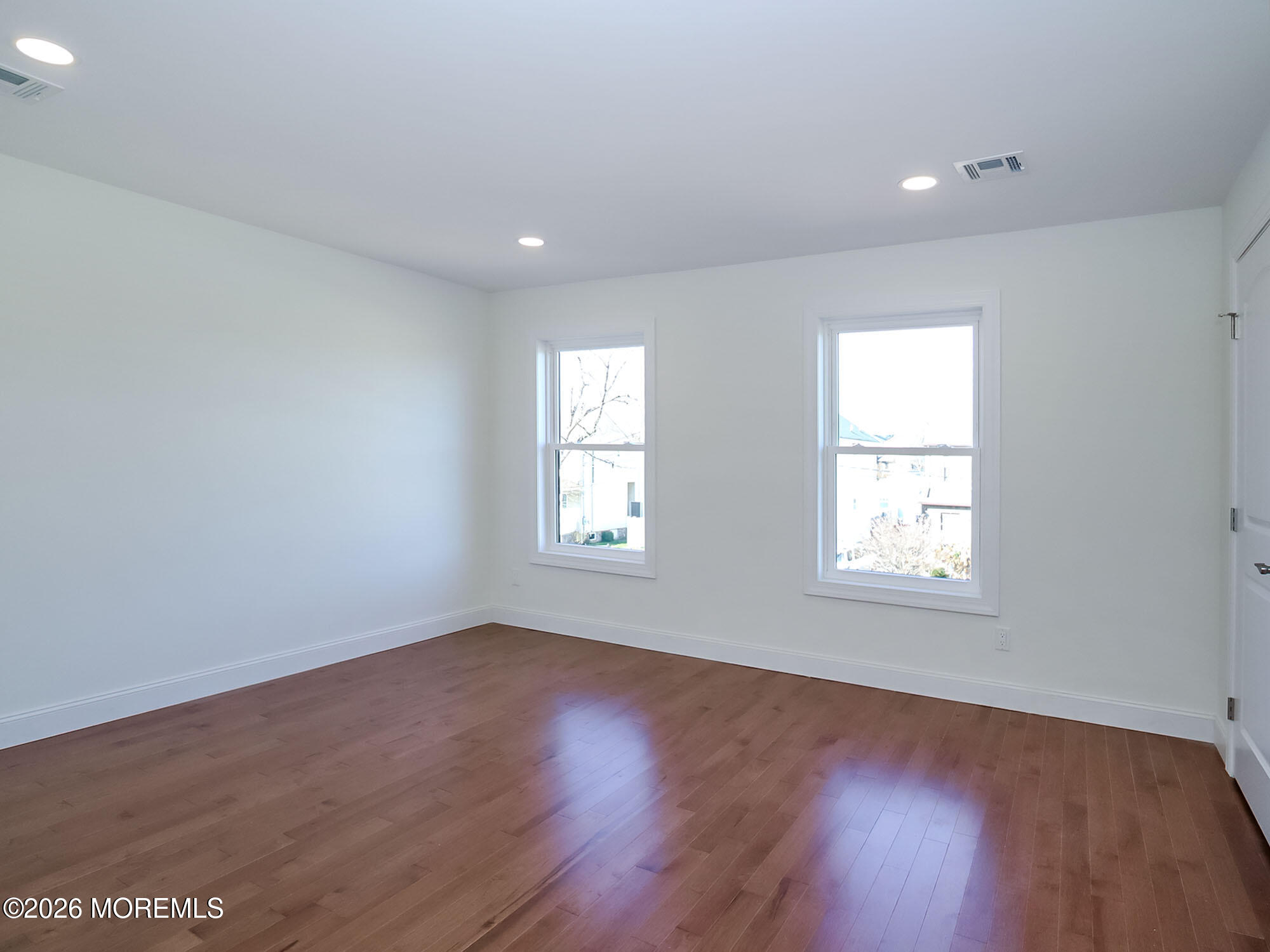 22 Marion Street Red Bank, NJ 07701 - Photo 34 of 50 an empty room with wooden floor and windows