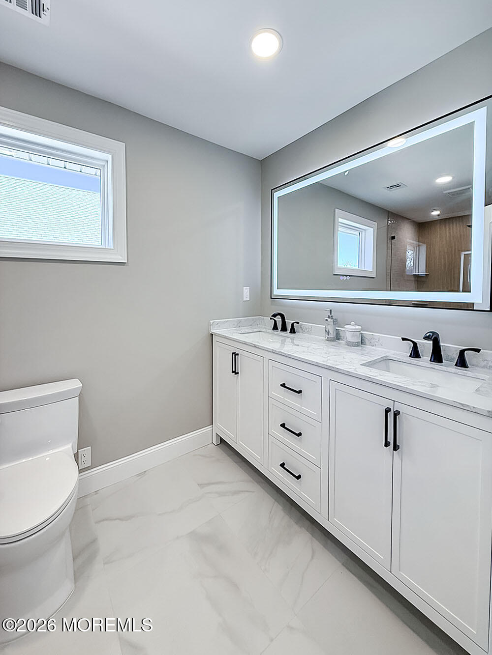 22 Marion Street Red Bank, NJ 07701 - Photo 42 of 50 a bathroom with a toilet sink and mirror