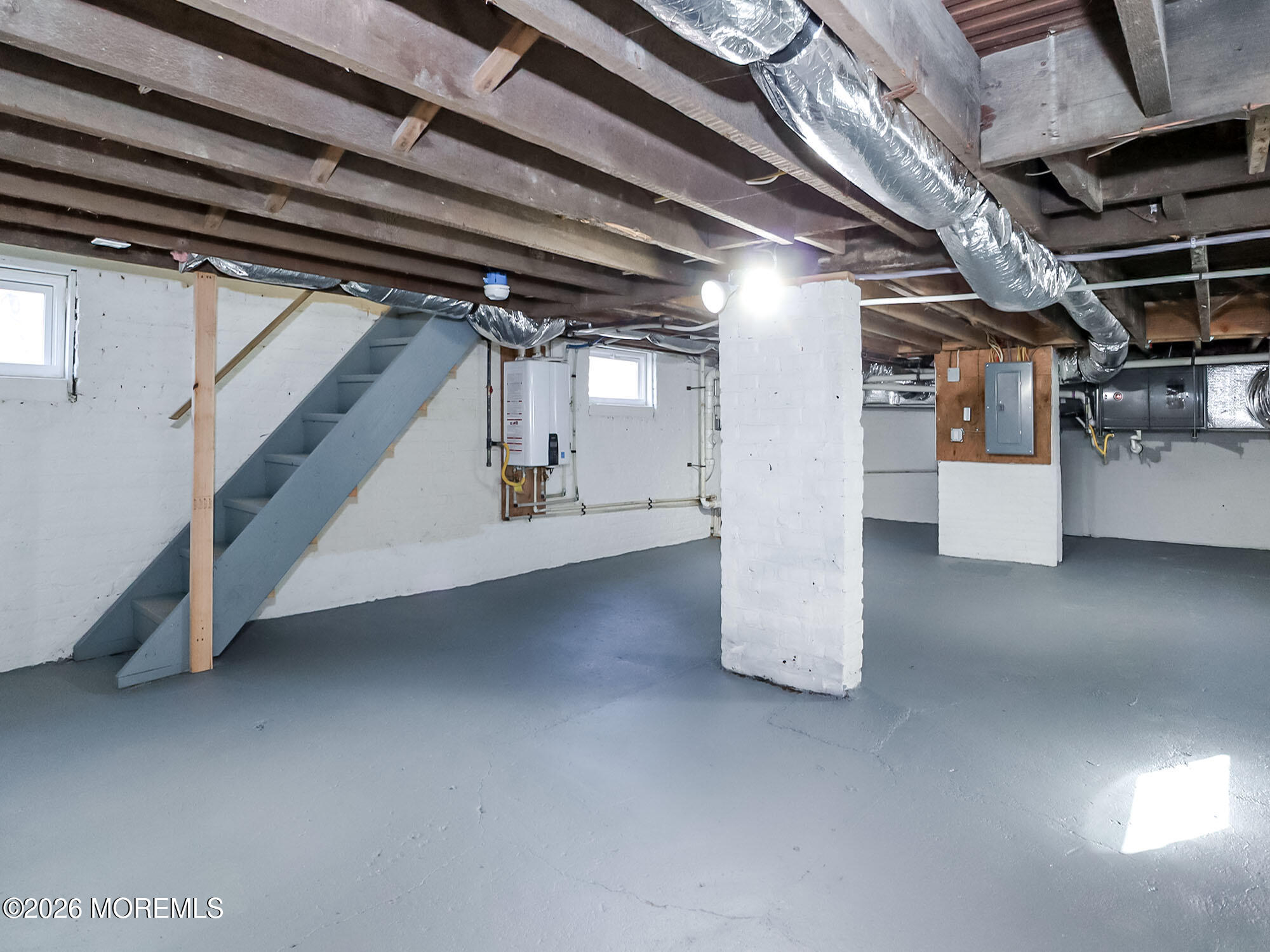 22 Marion Street Red Bank, NJ 07701 - Photo 44 of 50 a view of water heater room with stairs
