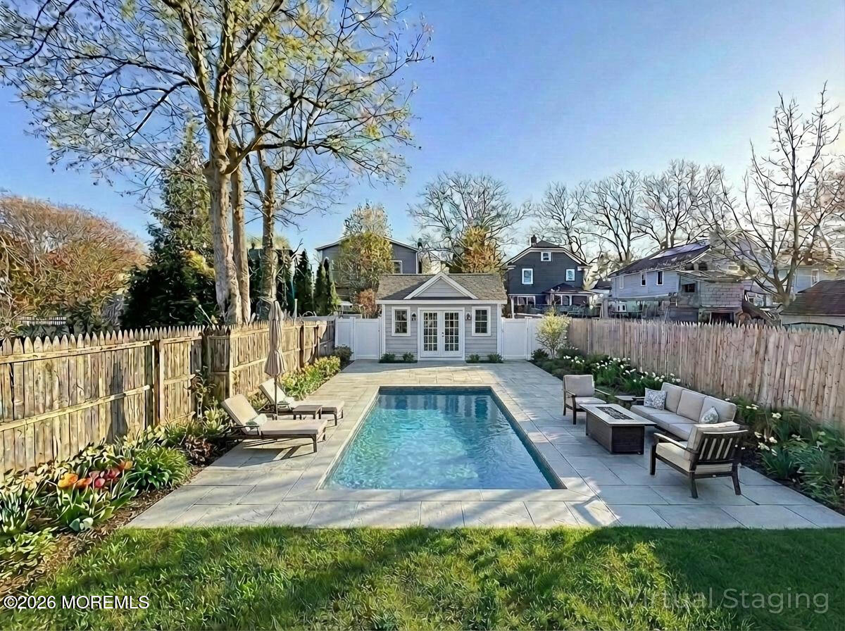 22 Marion Street Red Bank, NJ 07701 - Photo 49 of 50 a view of a house with backyard and sitting area