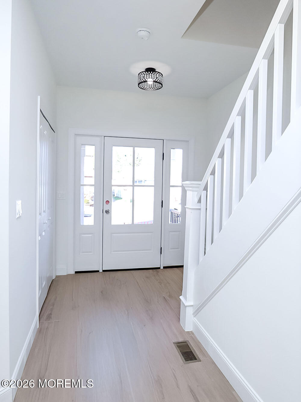 22 Marion Street Red Bank, NJ 07701 - Photo 6 of 50 a view of an entryway with wooden floor