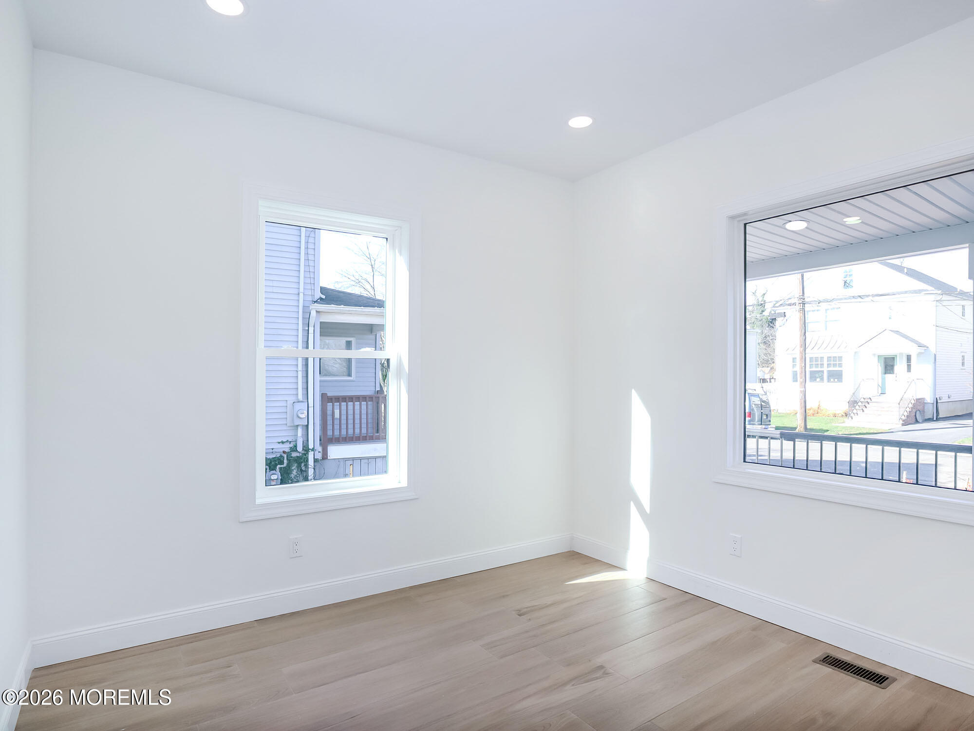 22 Marion Street Red Bank, NJ 07701 - Photo 7 of 50 an empty room with wooden floor and windows
