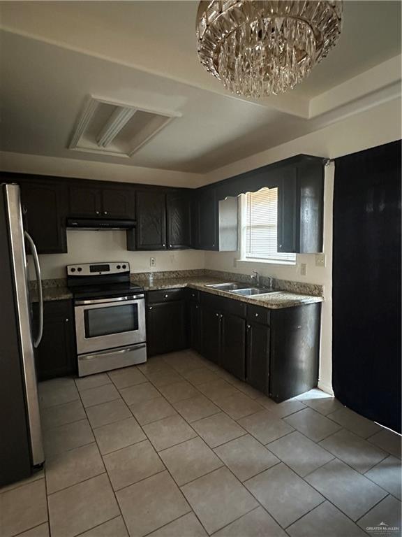3703 South Radisson Avenue, Unit 3 Pharr, TX 78577 - Photo 3 of 11 a kitchen with a sink stainless steel appliances and cabinets