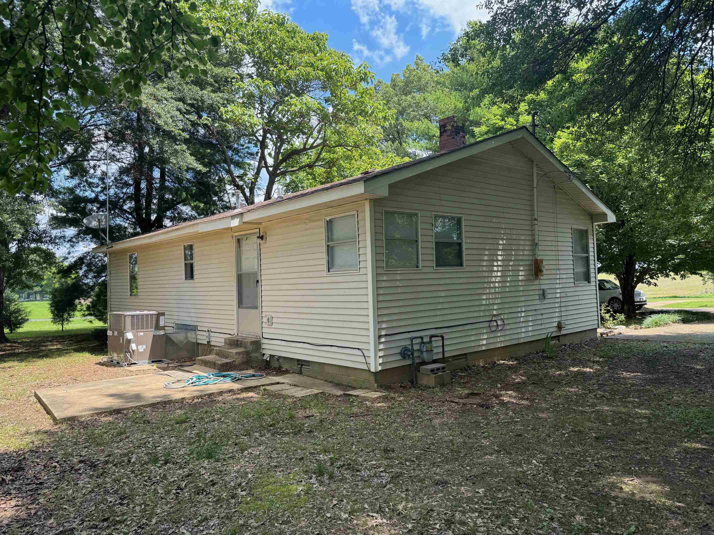 323 Easley Road Newbern, TN 38059 - Photo 11 of 13 a view of a house with a yard