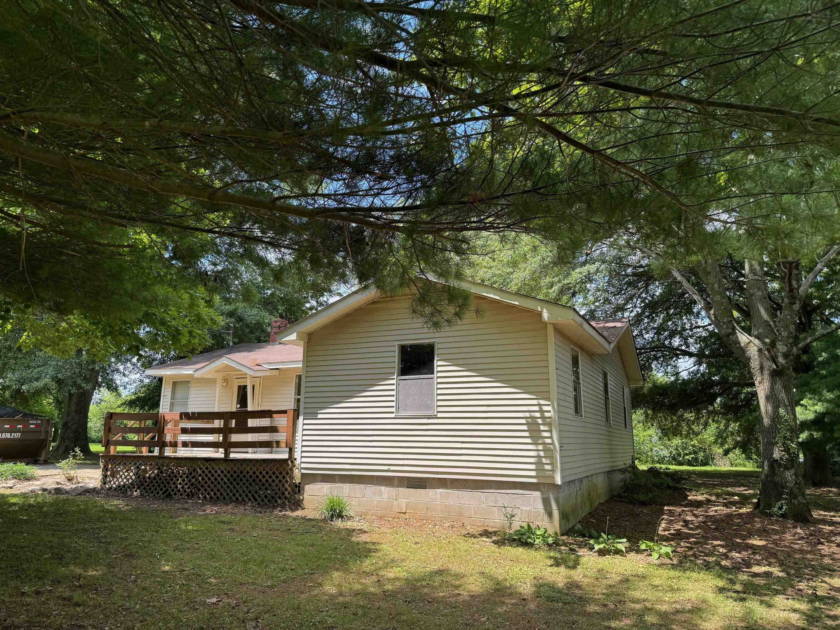 323 Easley Road Newbern, TN 38059 - Photo 12 of 13 a house that has a tree in front of the house