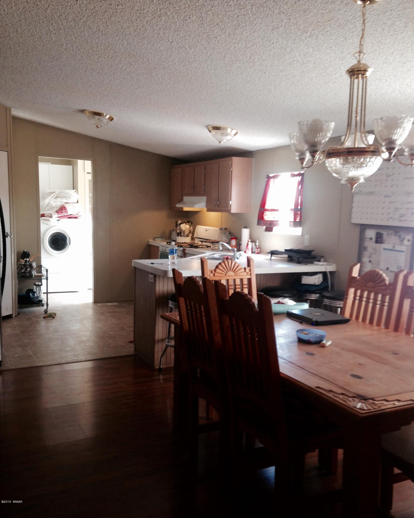 1117 Ranch Road Taylor, AZ 85939 - Photo 1 of 11 a view of a dining room with furniture