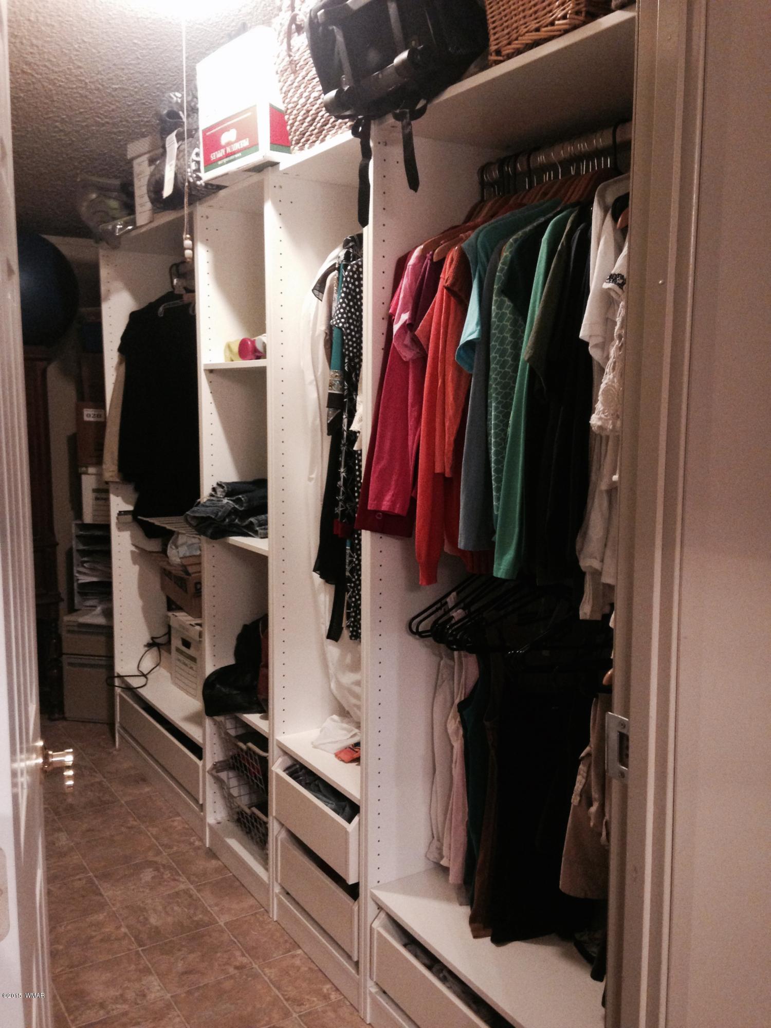 1117 Ranch Road Taylor, AZ 85939 - Photo 8 of 11 a view of walk in closet with clothes and shoes