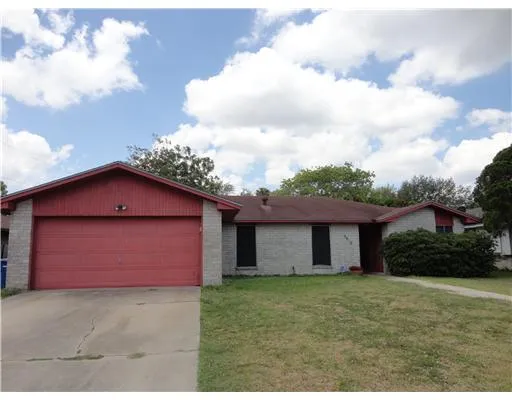 a view of a backyard of the house