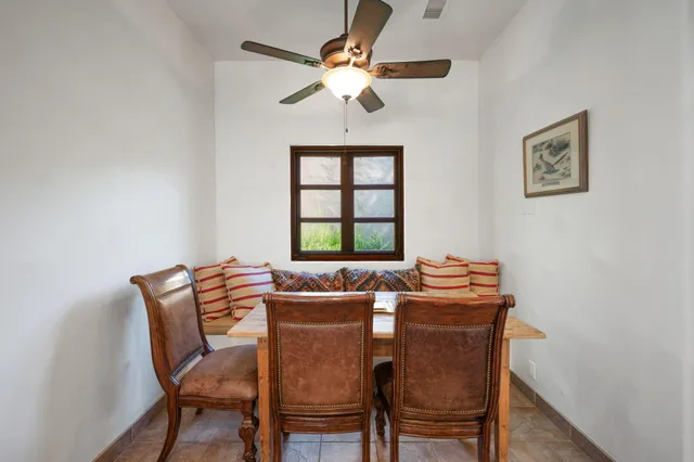 a view of swimming pool with outdoor seating and plants
