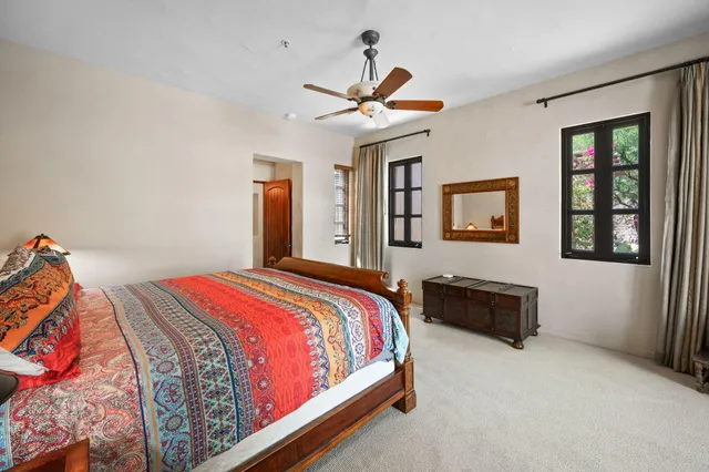 a bathroom with a toilet sink shower and mirror
