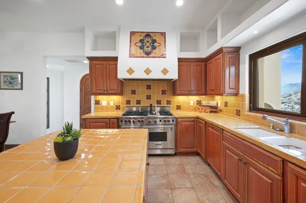 a living room with furniture a fireplace and a book shelf