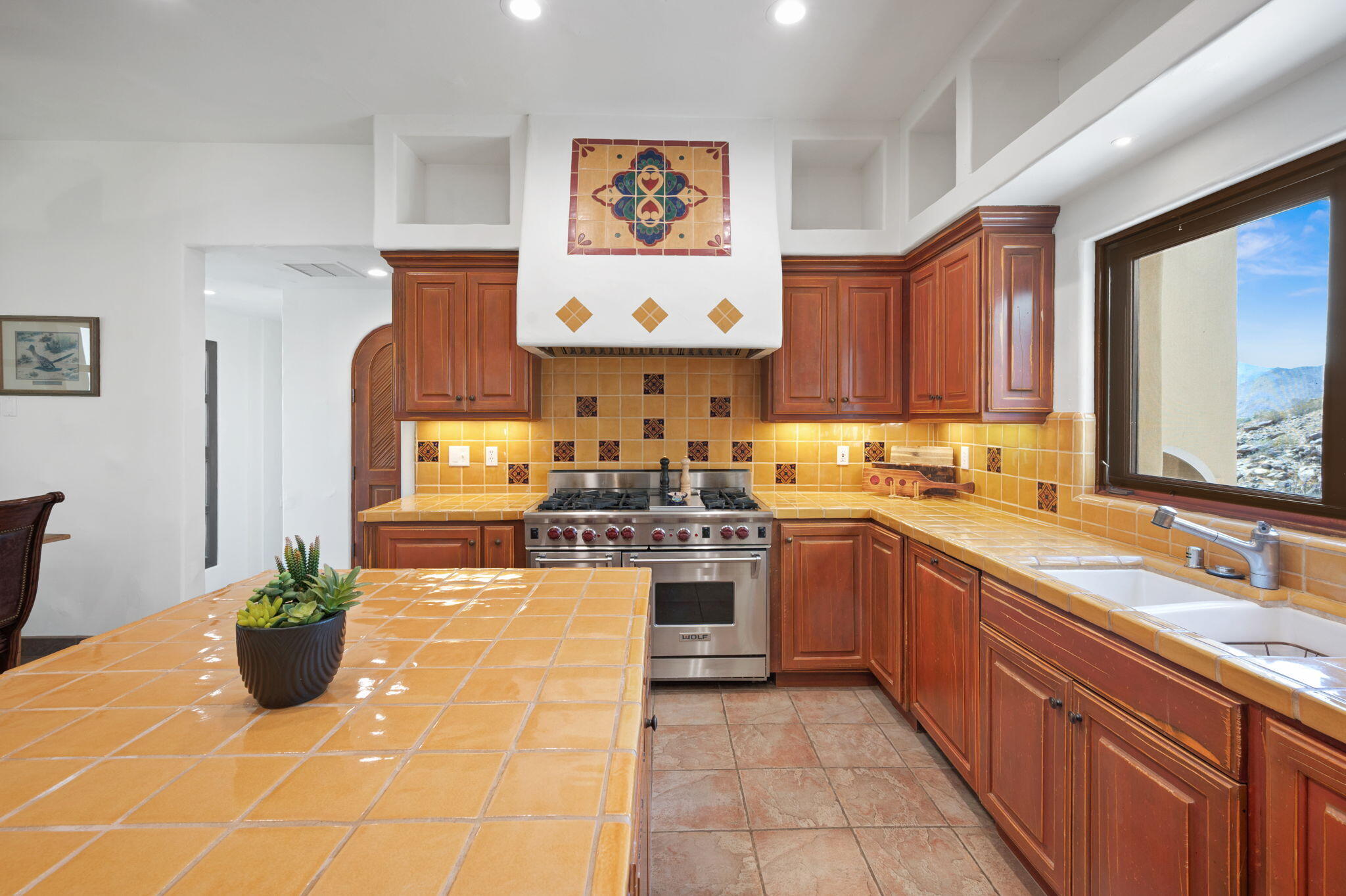 72275 Upper Way West Palm Desert, CA 92260 - Photo 21 of 68 a kitchen with stainless steel appliances granite countertop a stove a sink and a refrigerator