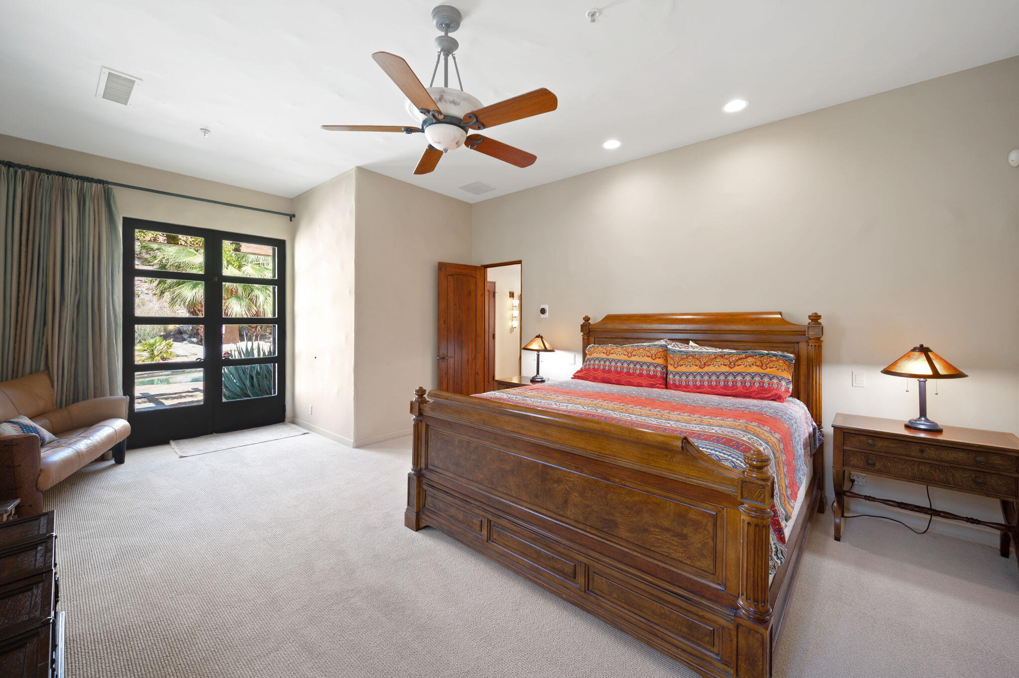 72275 Upper Way West Palm Desert, CA 92260 - Photo 25 of 68 a bedroom with a bed and a ceiling fan