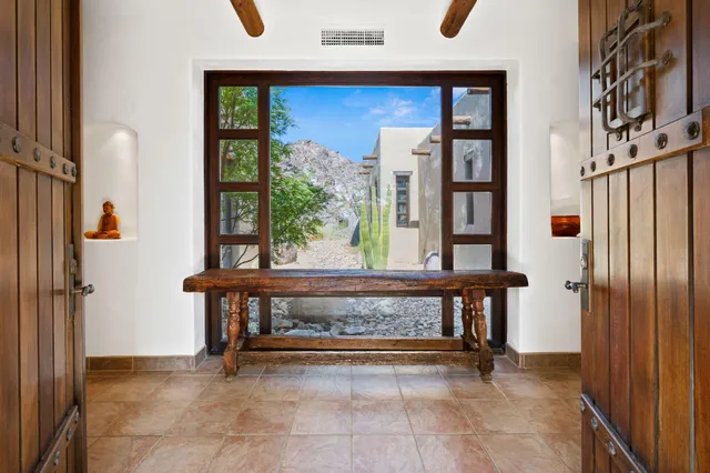 a dining room with furniture and window