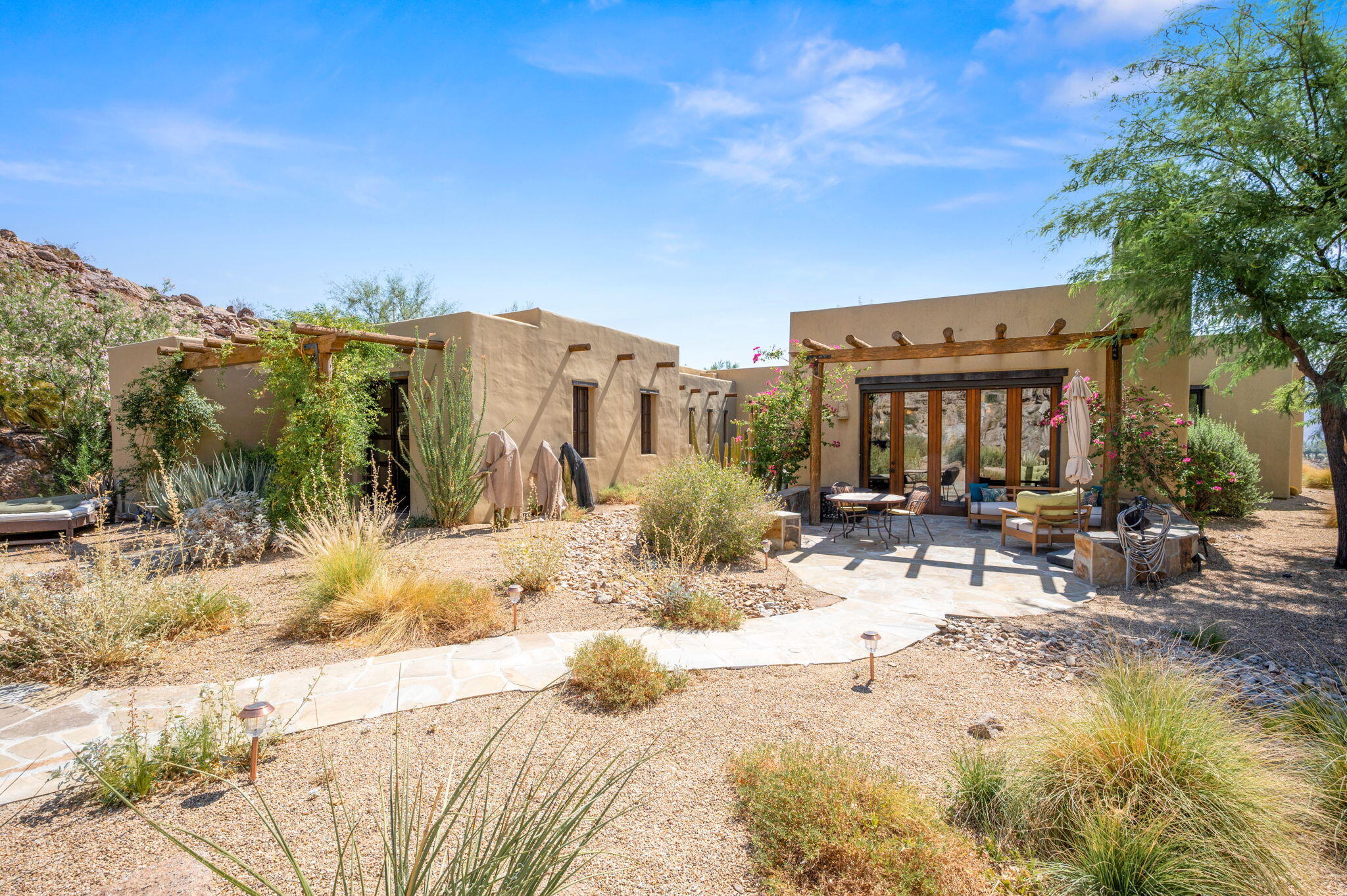 72275 Upper Way West Palm Desert, CA 92260 - Photo 43 of 68 a view of roof with a yard and sitting area