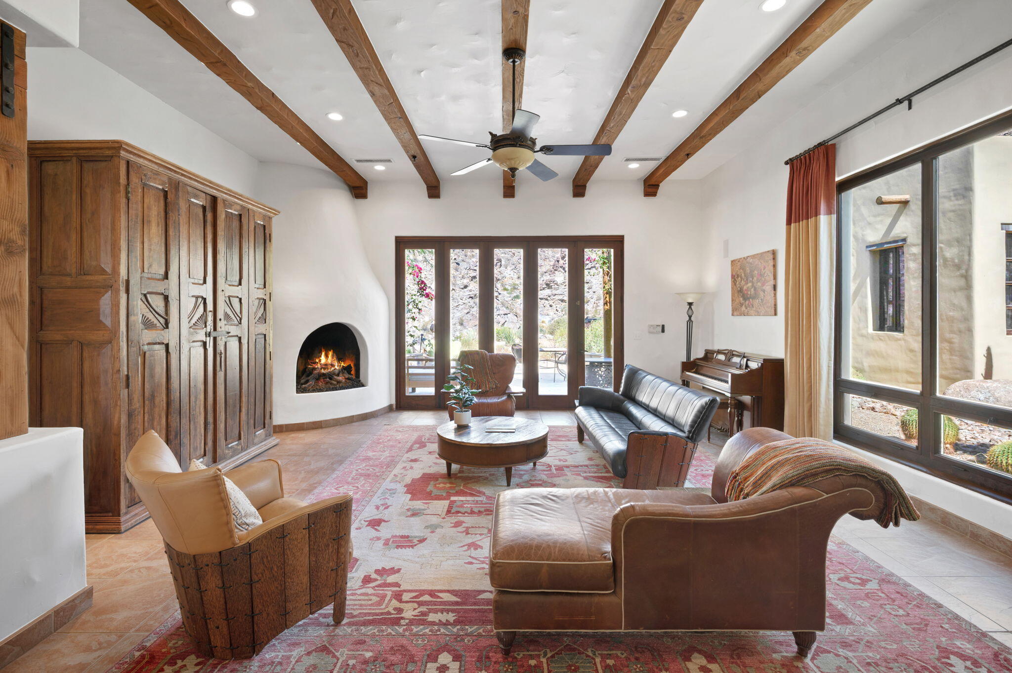 72275 Upper Way West Palm Desert, CA 92260 - Photo 10 of 68 a living room with fireplace furniture and a large window